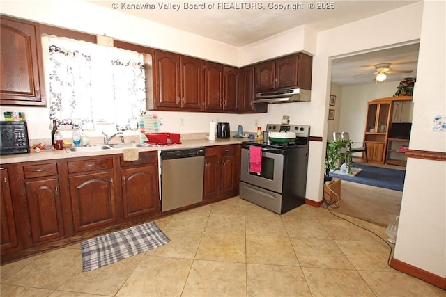 5005 Buffy Dr, Cross Lanes, WV 25313 - kitchen with stainless steel appliances, under cabinet range hood, light countertops, and a ceiling fan