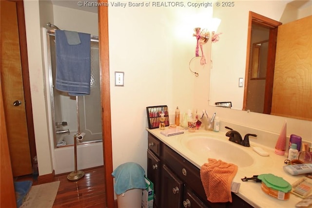 5005 Buffy Dr, Cross Lanes, WV 25313 - bathroom with vanity, wood finished floors, and shower / bath combination