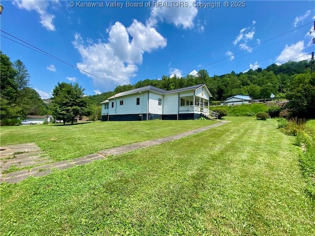 391 River Rd, Racine, WV 25165 - view of home's exterior with a lawn