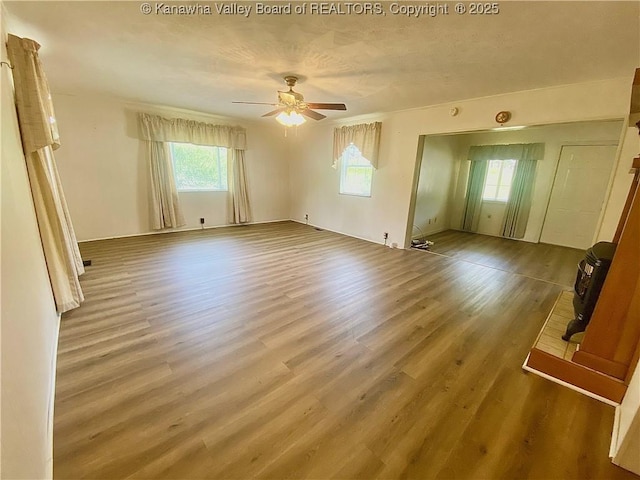 391 River Rd, Racine, WV 25165 - unfurnished room featuring healthy amount of natural light, wood finished floors, and ceiling fan