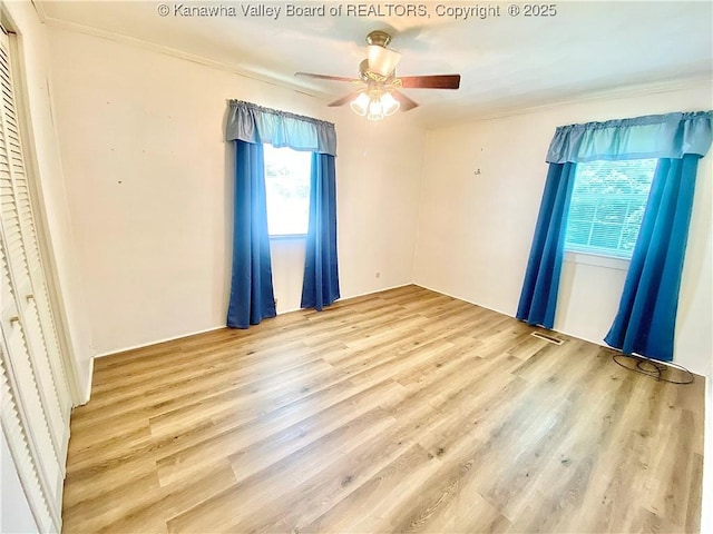 391 River Rd, Racine, WV 25165 - unfurnished bedroom featuring ornamental molding, wood finished floors, and a ceiling fan