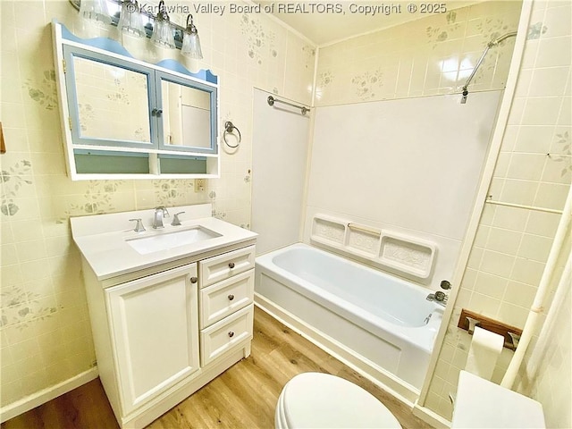 391 River Rd, Racine, WV 25165 - bathroom featuring wood finished floors, vanity, and shower / bathtub combination