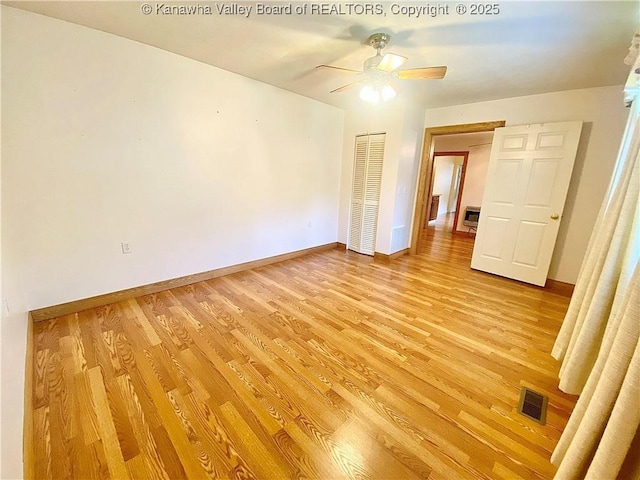 391 River Rd, Racine, WV 25165 - unfurnished room featuring light wood-type flooring and a ceiling fan