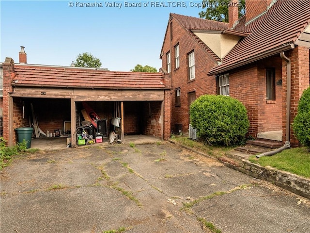 5 Manor Pl, Charleston, WV 25311 - view of property exterior featuring a chimney and brick siding
