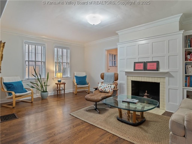 5 Manor Pl, Charleston, WV 25311 - sitting room featuring ornamental molding, a tile fireplace, and wood finished floors