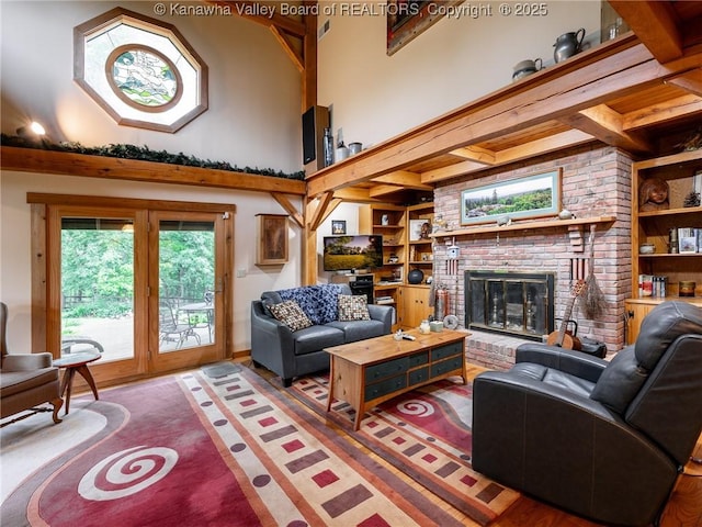 114 Shady Ln, Winfield, WV 25213 - living room featuring a high ceiling, a fireplace, and built in features