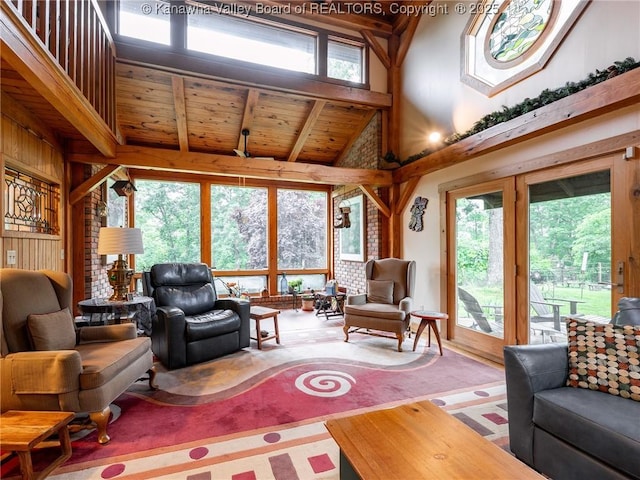 114 Shady Ln, Winfield, WV 25213 - living area with high vaulted ceiling, healthy amount of natural light, a wood ceiling with exposed beams, and wooden walls