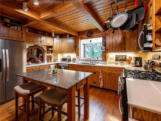 114 Shady Ln, Winfield, WV 25213 - kitchen featuring stainless steel appliances, a wooden ceiling with exposed beams, dark wood-style flooring, brown cabinets, and open shelves