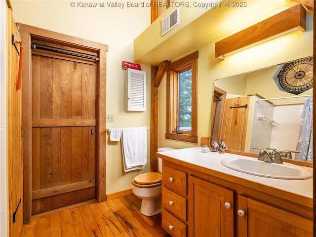 114 Shady Ln, Winfield, WV 25213 - full bathroom featuring vanity, wood-type flooring, and curtained shower