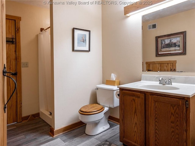 114 Shady Ln, Winfield, WV 25213 - bathroom with wood finished floors, vanity, and a stall shower