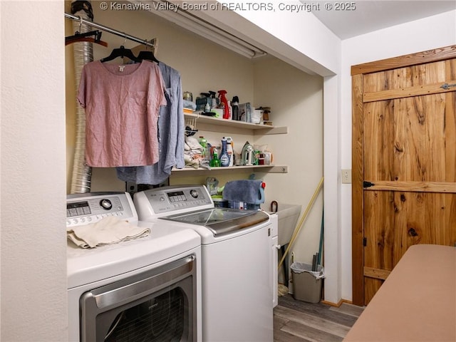 114 Shady Ln, Winfield, WV 25213 - washroom with washer and dryer and wood finished floors