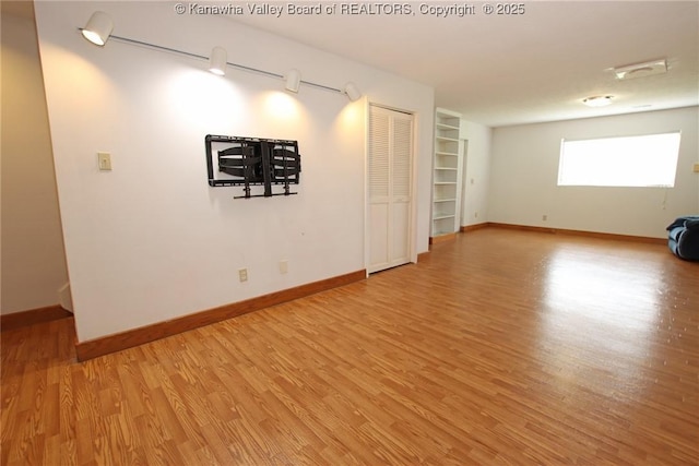 1302 Hunters Ridge Rd, Charleston, WV 25314 - empty room featuring light wood finished floors and built in features