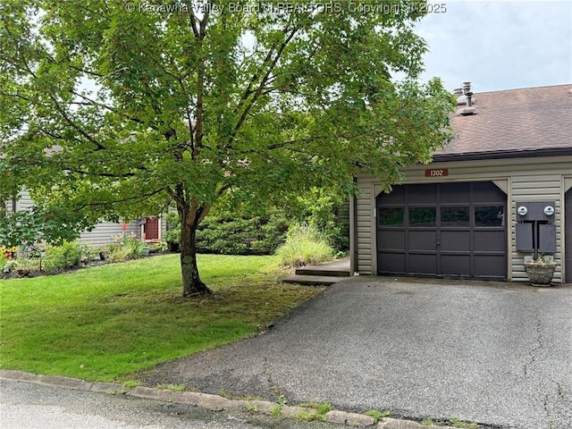 1302 Hunters Ridge Rd, Charleston, WV 25314 - view of property exterior with a yard, a garage, asphalt driveway, and roof with shingles