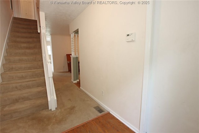 1302 Hunters Ridge Rd, Charleston, WV 25314 - stairway featuring baseboards and a textured ceiling