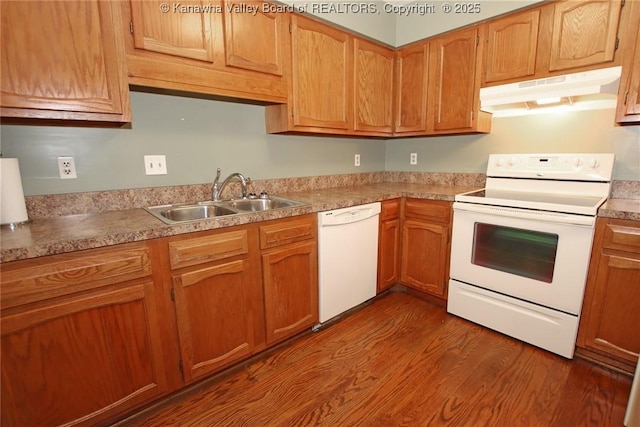 1302 Hunters Ridge Rd, Charleston, WV 25314 - kitchen with white appliances, under cabinet range hood, dark wood finished floors, and light countertops