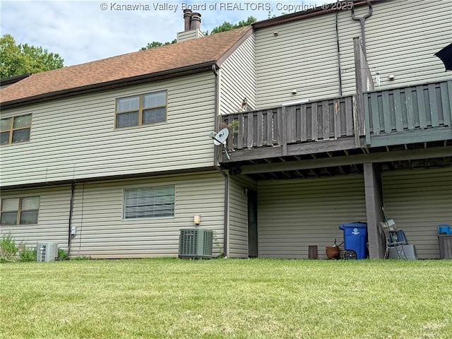 1302 Hunters Ridge Rd, Charleston, WV 25314 - back of property featuring a lawn, a deck, a chimney, and a shingled roof