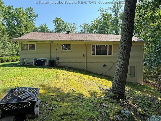 1500 Longridge Rd, Charleston, WV 25314 - back of house with an outdoor fire pit and a lawn
