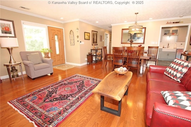 1500 Longridge Rd, Charleston, WV 25314 - living room featuring wood finished floors, crown molding, and recessed lighting