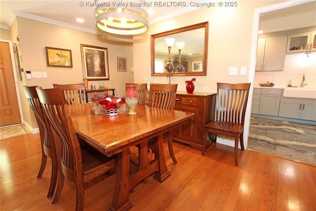 1500 Longridge Rd, Charleston, WV 25314 - dining space with crown molding, light wood finished floors, and recessed lighting