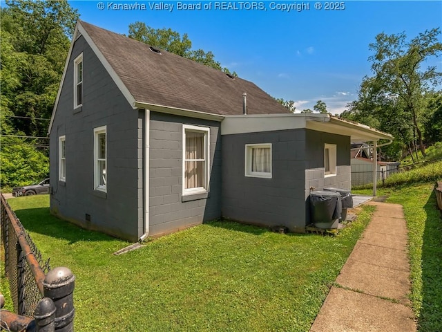 567 Garrison Ave, Charleston, WV 25302 - view of side of home featuring a shingled roof and concrete block siding