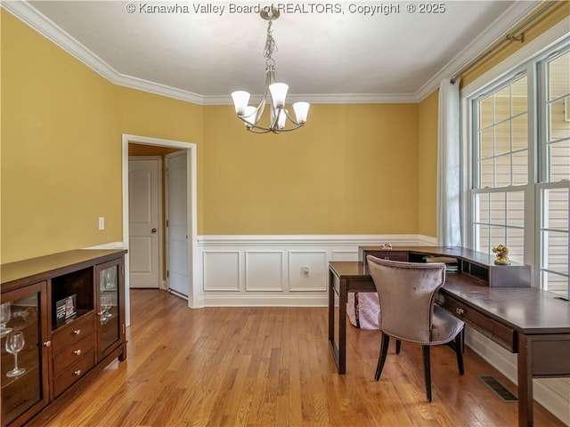 35 Hyde Park Rd, Winfield, WV 25213 - dining room with a chandelier, plenty of natural light, light wood-type flooring, ornamental molding, and wainscoting
