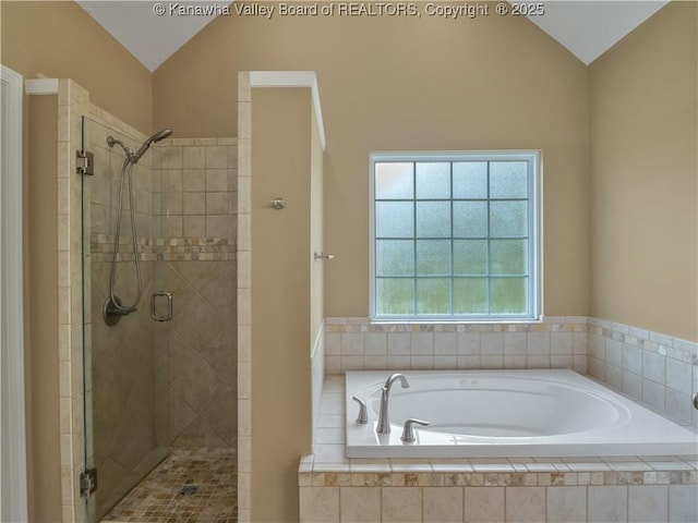 35 Hyde Park Rd, Winfield, WV 25213 - bathroom with vaulted ceiling, a garden tub, and a stall shower