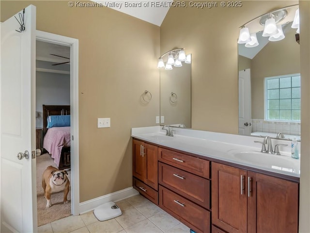 35 Hyde Park Rd, Winfield, WV 25213 - ensuite bathroom featuring lofted ceiling, double vanity, tile patterned flooring, and a tub to relax in