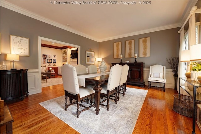 135 E Ridge Rd, Charleston, WV 25314 - dining area featuring ornamental molding, wood finished floors, wainscoting, and a decorative wall