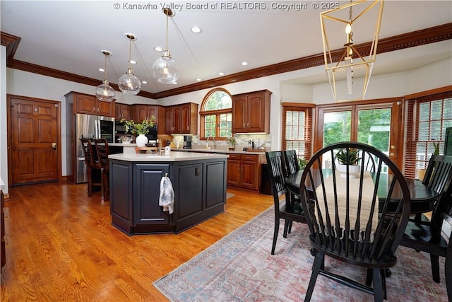 135 E Ridge Rd, Charleston, WV 25314 - kitchen featuring light countertops, stainless steel refrigerator with ice dispenser, plenty of natural light, decorative backsplash, and recessed lighting