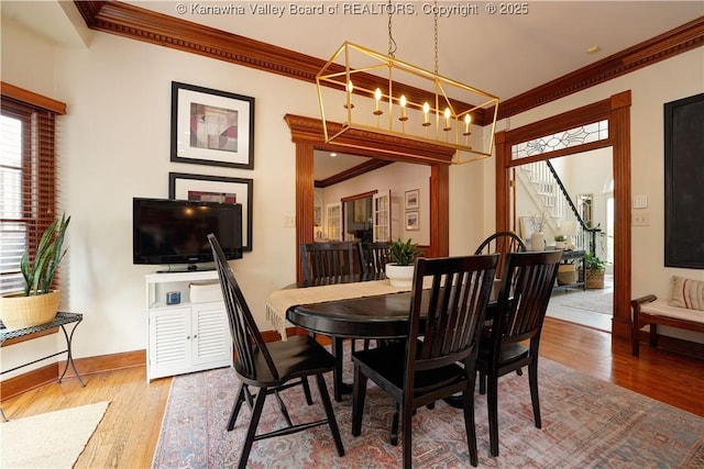 135 E Ridge Rd, Charleston, WV 25314 - dining area with ornamental molding, wood finished floors, and stairway