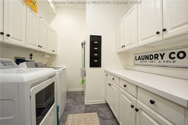 135 E Ridge Rd, Charleston, WV 25314 - laundry room featuring washing machine and dryer, cabinet space, and dark tile patterned flooring