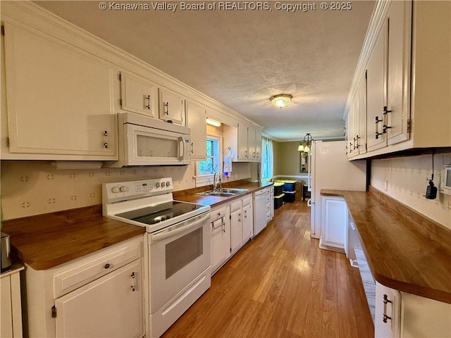 169 Myrtle Tree Rd, South Charleston, WV 25309 - kitchen with white appliances, light wood-type flooring, white cabinetry, butcher block counters, and crown molding