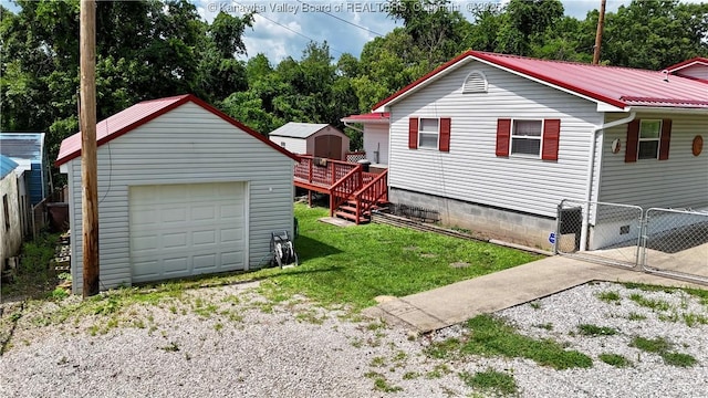 169 Myrtle Tree Rd, South Charleston, WV 25309 - view of home's exterior featuring a detached garage, a metal roof, and a shed