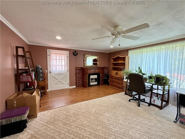 169 Myrtle Tree Rd, South Charleston, WV 25309 - office with crown molding, wood finished floors, ceiling fan, a textured ceiling, and a fireplace