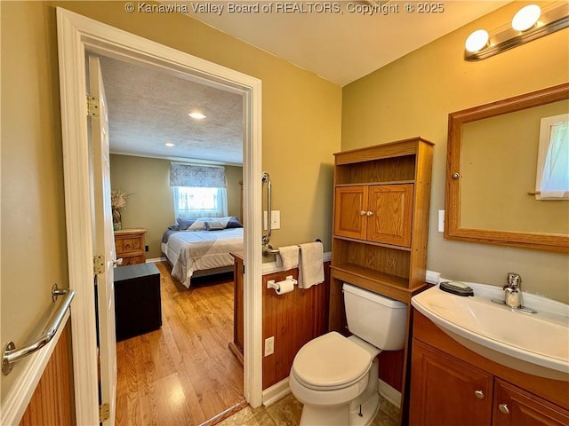 169 Myrtle Tree Rd, South Charleston, WV 25309 - bathroom featuring vanity, wood finished floors, and connected bathroom