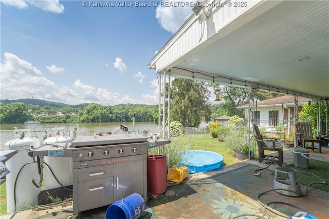 1324 Kanawha Ave, Dunbar, WV 25064 - view of patio with a grill and a water view