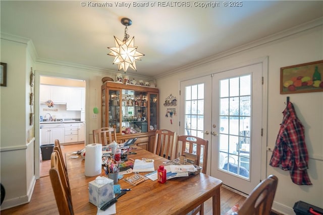 1324 Kanawha Ave, Dunbar, WV 25064 - dining room with french doors, ornamental molding, wood finished floors, and a chandelier