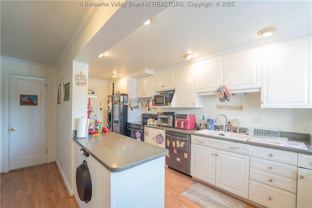 1324 Kanawha Ave, Dunbar, WV 25064 - kitchen featuring appliances with stainless steel finishes, ornamental molding, white cabinetry, light wood-type flooring, and a peninsula