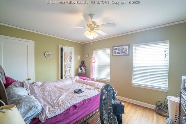 1324 Kanawha Ave, Dunbar, WV 25064 - bedroom featuring light wood-style flooring, ornamental molding, multiple windows, and a ceiling fan