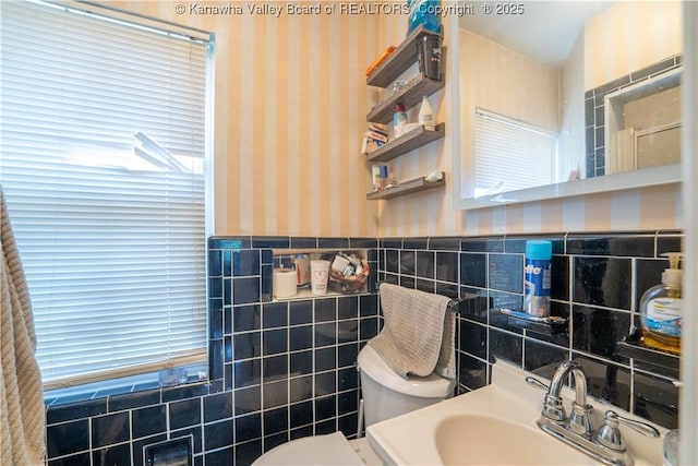 1324 Kanawha Ave, Dunbar, WV 25064 - bathroom featuring tile walls, wallpapered walls, and a wainscoted wall