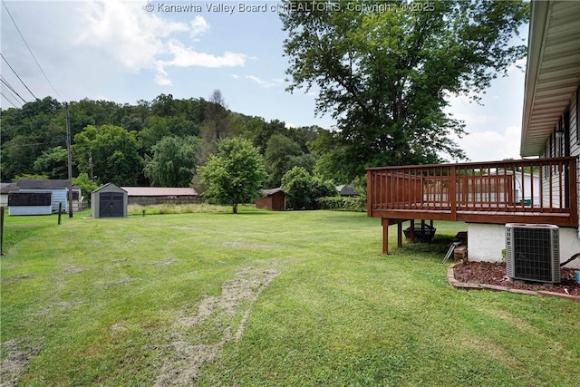 55 Corky Dr, Poca, WV 25159 - view of grassy yard with a storage unit and a wooden deck