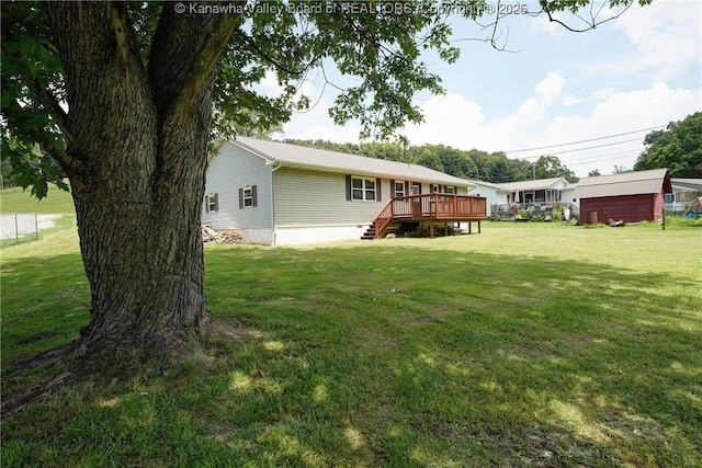 55 Corky Dr, Poca, WV 25159 - rear view of house featuring a wooden deck, a yard, and stairs