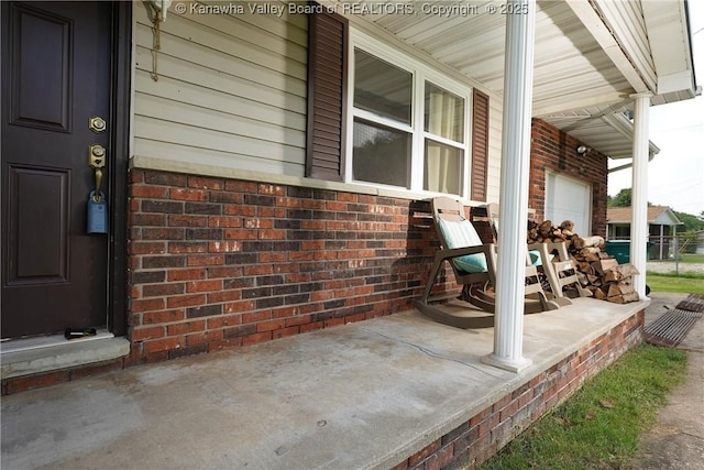 55 Corky Dr, Poca, WV 25159 - covered porch featuring a garage