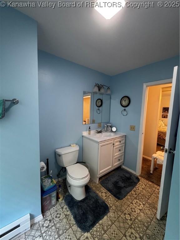 1198 Caney Branch Rd, Chapmanville, WV 25508 - bathroom with baseboard heating and vanity