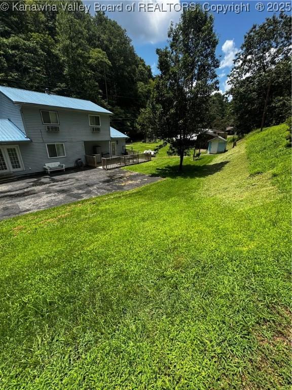 1198 Caney Branch Rd, Chapmanville, WV 25508 - view of grassy yard featuring a patio