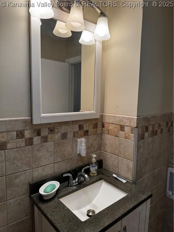 1198 Caney Branch Rd, Chapmanville, WV 25508 - bathroom with tile walls, vanity, and wainscoting