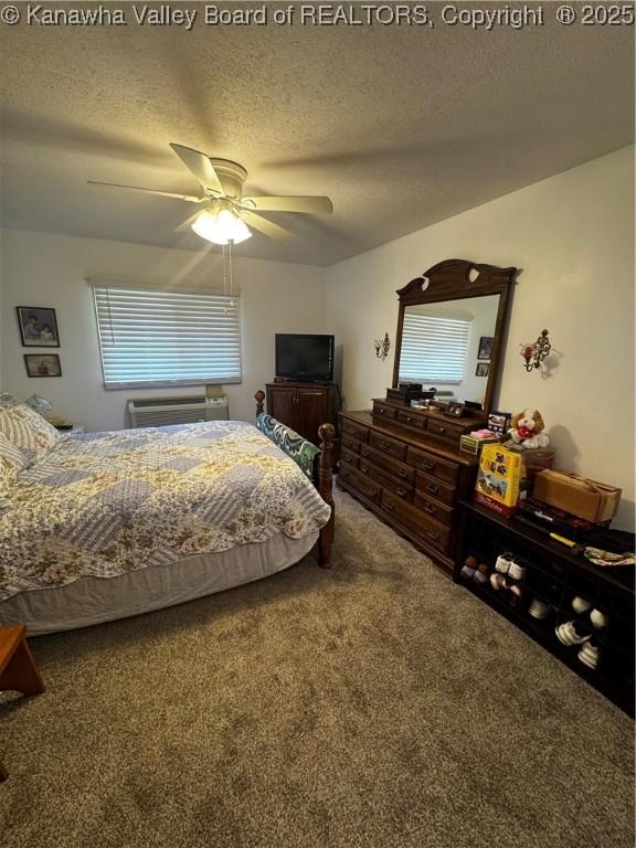 1198 Caney Branch Rd, Chapmanville, WV 25508 - carpeted bedroom featuring a textured ceiling and ceiling fan