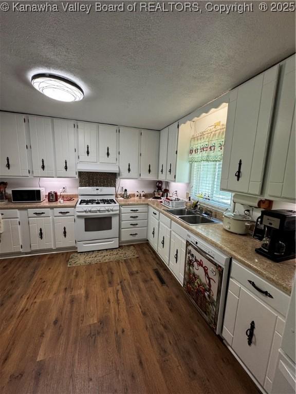 1198 Caney Branch Rd, Chapmanville, WV 25508 - kitchen featuring white appliances, a textured ceiling, white cabinets, under cabinet range hood, and dark wood finished floors