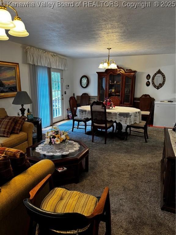 1198 Caney Branch Rd, Chapmanville, WV 25508 - living room featuring a chandelier, a textured ceiling, and carpet floors
