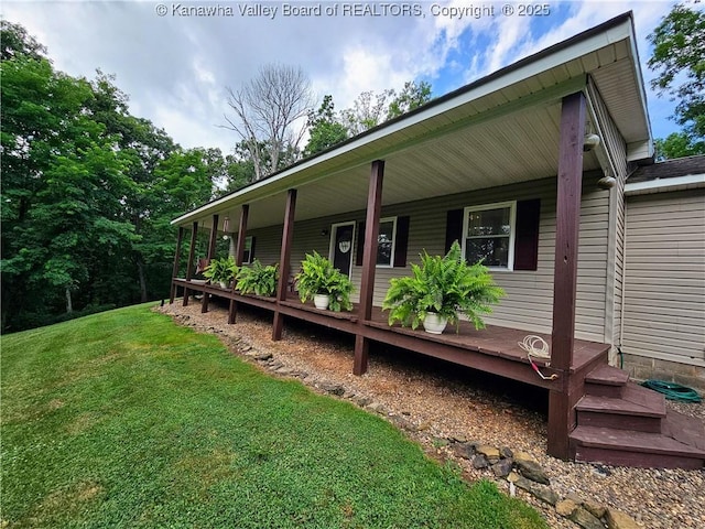 438 Tanglewood Dr, Point Pleasant, WV 25550 - view of home's exterior with a porch and a lawn
